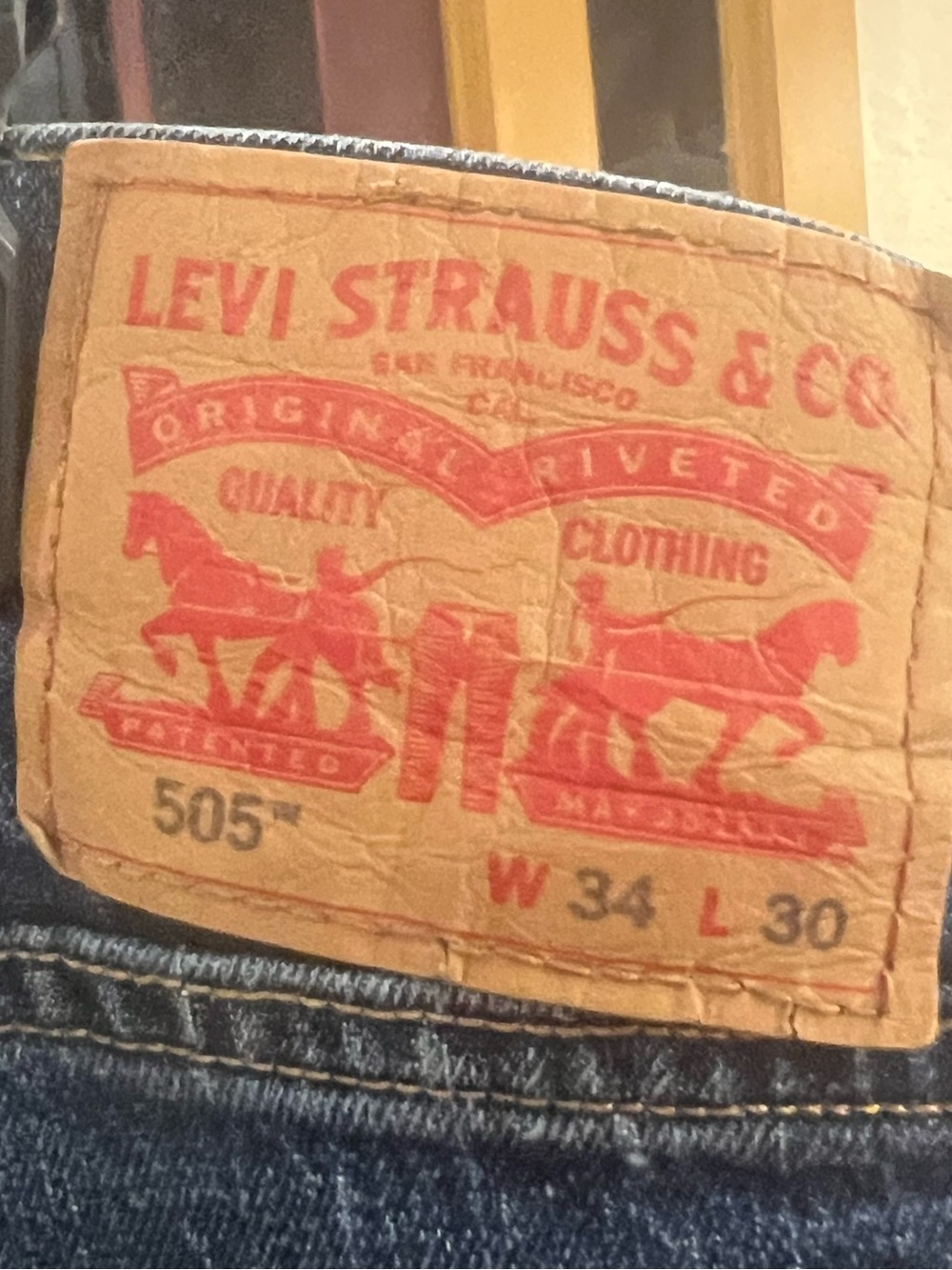 Levi's 505 Relaxed Fit Men's Jeans in Dark Blue with Tan Patch